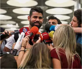  ??  ?? Diego Costa speaking to the media upon arrival at the Adolfo Suarez Madrid Barajas airport on Friday. — Reuters Man of the hour: