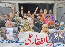  ?? AP photo ?? Family members and relatives of Zulfikar Ali, convicted of drug crimes, demand his release during a protest, in Lahore, Pakistan, Wednesday.