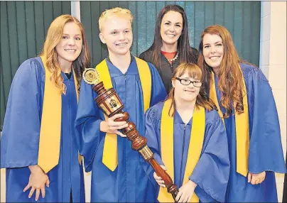  ??  ?? Westisle Composite High School principal Heidi Morgan congratula­tes graduating students, from left, Dena McHugh, Governor General’s medal winner; Calvin Murray, student council president and fourth highest-ranking academic student; Sarah Shea,...