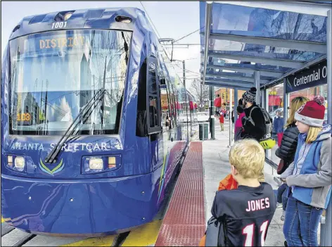  ?? CONTRIBUTE­D BY JONATHAN PHILLIPS / 2014 ?? The Centennial Olympic Park stop is just one of 12 spots that can be reached via the Atlanta Streetcar. The 2.7-mile route, which opened on Dec. 30, 2014, has streetcars that run every 10 to 15 minutes daily, with free rides for the first three months.