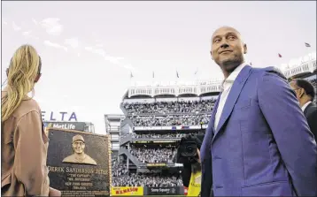  ?? KATHY WILLENS / AP ?? The Yankees retired former shortstop Derek Jeter’s No. 2 during a pregame ceremony before Sunday night’s game at Yankee Stadium. His plaque will be placed in Monument Park beyond center field.