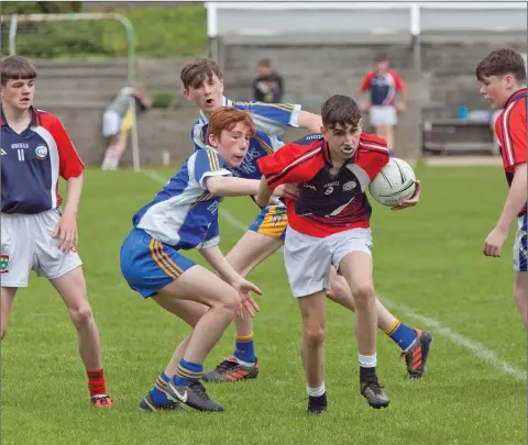  ??  ?? Action from the First Year football county final between Coláiste Bhríde Carnew and Coláiste Cill Mhantain.