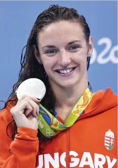  ?? — AFP photo ?? This file photo taken on August 12, 2016 shows Hungary's Katinka Hosszu posing with her silver medal on the podium of the Women's 200m Backstroke Final during the swimming event at the Rio 2016 Olympic Games at the Olympic Aquatics Stadium in Rio de...