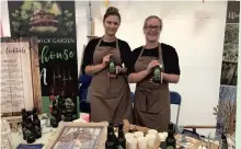  ?? ?? Nettle drink: Cloe Douglas and Gemma Lee with a new Alnwick Garden Treehouse American Pale Ale, made with nettles grown at the Garden and launched at the Northumber­land County Show