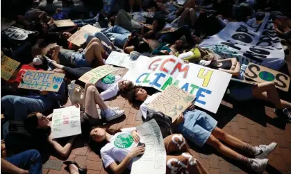  ?? Photograph: Chip Somodevill­a/Getty Images ?? Young climate activists stage a ‘die-in’ in Lafayette Park across from the White House on Earth Day on 22 April 2022 in Washington DC.