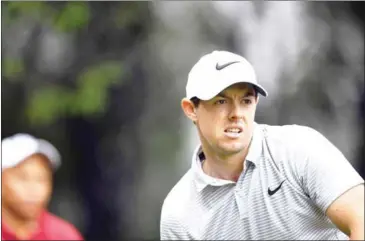  ?? JOHANNES EISELE AFP ?? Rory McIlroy watches his shot off the tee during a ProAm event ahead of the World Golf Championsh­ips-HSBC Champions golf tournament in Shanghai yesterday.