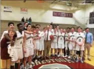  ?? BRUCE ADAMS - DIGITAL FIRST MEDIA ?? Conestoga players celebrate with head coach Mike Troy after he posted his 300th career win Thursday night by beating Strath Haven.