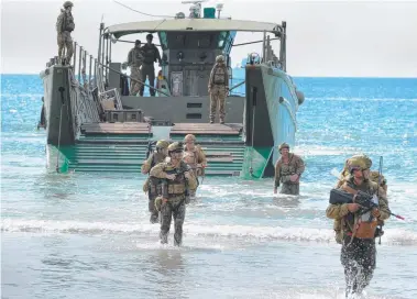  ?? SE: Australian Army troops come ashore on an LCM- 8 at Freshwater Beach in Shoalwater Bay Training Area. ??