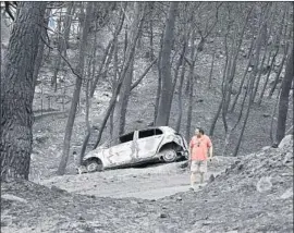  ?? Yorgos Karahalis Associated Press ?? THE GREEK seaside neighborho­od of Neos Voutzas is a moonscape the day after the July 23 wildfire. About 90 people are believed to have died in the blaze.