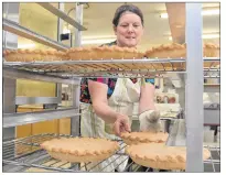  ?? COLIN MACLEAN/JOURNAL PIONEER ?? Claudette Arsenault racks up some of the many meat pies La Galette Blanche in Abram-Village will sell during the holiday season. The pies are a local tradition.