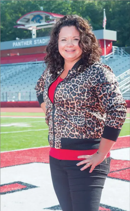  ?? WILLIAM HARVEY/THREE RIVERS EDITION ?? Cindy Jones stands on the field at Cabot High School’s football stadium. Jones said the Cabot Panther Foundation and Centennial Bank recently contribute­d funds to purchase and install Arkansas’ largest video board at Panther Stadium.