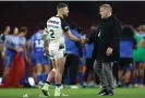  ?? Photograph: Michael Steele/Getty Images ?? Tommy Makinson and Shaun Wane commiserat­e with a handshake after England’s semi-final loss.