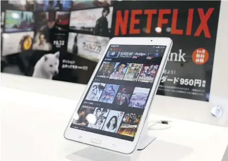  ?? KEN ISHII/GETTY IMAGES/FILE ?? Movie titles are displayed at the Tokyo launch event for Netflix in Japan last September. Netflix is having trouble matching its North American success in some internatio­nal markets.