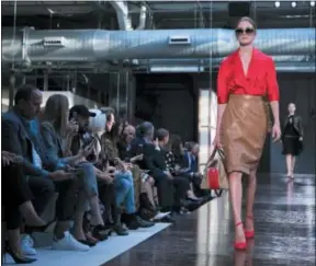  ?? PHOTOS BY VIANNEY LE CAER/INVISION/AP ?? A model wears a creation by Burberry during their Spring/Summer 2019 runway show at London Fashion Week in London, Monday, Sept. 17, 2018.