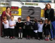  ??  ?? The five-day 3-year-olds class with Mrs. Marybeth Blasetti of Radnor and Mrs. Kate Spackman of Chester Springs, stand in front of the Berwyn Fire Company’s No. 2 Engine.