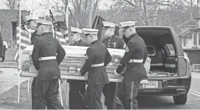  ?? HEATHER SEVIGNY/FOR THE DAILY JEFFERSONI­AN ?? Members of the U.S. Marine Corps Lima Company, 3rd Battalion, 25th Marines carry the body of Gunnery Sgt. James Speedy from the hearse into the Thorn-black Funeral home in Cambridge on Friday.