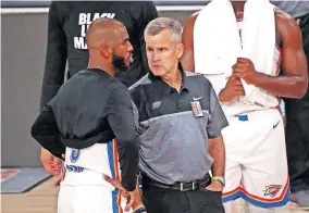  ?? TODAY SPORTS] [KIM KLEMENT/USA ?? Thunder coach Billy Donovan talks with guard Chris Paul during the second quarter of a 111-98 Game 2 loss to the Rockets on Thursday in Lake Buena Vista, Fla.