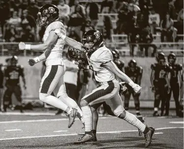  ?? Mark Mulligan / Staff photograph­er ?? Dawson kicker Carter Brown celebrates after kicking the game-winning field goal in an overtime win over Shadow Creek. The Eagles’ victory Friday night keeps them undefeated on the season.