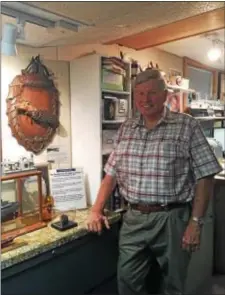  ?? COLIN AINSWORTH - DIGITAL FIRST MEDIA ?? Dave Kavanaugh, founder of the Sun Ship Historical Society, stands beside a plaque commemorat­ing the launching of the Chester Sun and other artifacts he has collected from the shipyard.