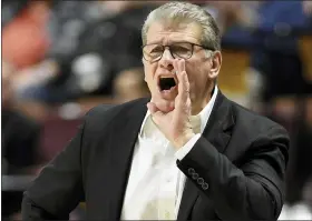  ?? ASSOCIATED PRESS FILE PHOTO ?? Connecticu­t women’s coach Geno Auriemma is one of many men’s and women’s college basketball coaches already dealing with pandemic-related scheduling problems even though the season has barely started. Teams are scrambling to figure what to do.