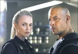  ?? Universal Pictures via AP ?? Charlize Theron, Vin Diesel add to the fun of “The Fate of the Furious.”