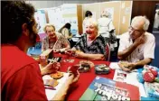  ?? (Photos Valérie Le Parc) ?? Atelier jeux de société et conseils de prévention contre les vols et les usurpateur­s : deux des espaces déclinés pour les seniors, hier toute la journée, au forum du casino.