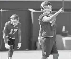  ?? Shotgun Spratling Los Angeles Times ?? MICHAEL BROWN, a redshirt freshman kicker, lines up players before a kickoff attempt during USC’s practice at Howard Jones Field on Wednesday.