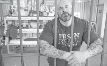  ?? Brett Coomer / Houston Chronicle ?? Bryan “BK” Klevens, a Houston Police narcotics sergeant and owner of Prison Break Tattoos, had to avoid showing his inked arms while on duty as a patrol officer.