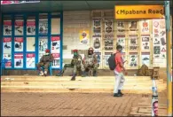  ?? (AP/Jerome Delay) ?? Ugandan security forces patrol the streets Wednesday near opposition leader Bobi Wine’s headquarte­rs in Kampala.