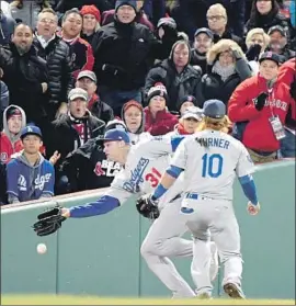  ?? Wally Skalij Los Angeles Times ?? DODGERS LEFT FIELDER Joc Pederson and third baseman Justin Turner can’t get to a bloop by Andrew Benintendi that falls for a seventh-inning double.