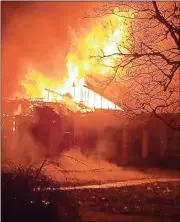  ?? Contribute­d photo ?? LEFT: Flames engulf the home at 70 Ridgeview Drive in Silver Creek on Thursday night.