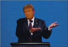  ?? JULIO CORTEZ — THE ASSOCIATED PRESS ?? President Donald Trump gestures while speaking during the first presidenti­al debate on Tuesday in Cleveland, Ohio.