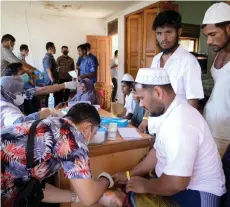  ?? — AFP photo ?? File photo shows newly arrived Rohingya refugees receiving medical treatment at their shelter in Meulaboh, West Aceh.