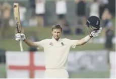  ??  ?? England captain Joe Root celebrates his second-innings ton.