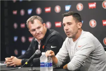  ?? Marcio Jose Sanchez / Associated Press ?? 49ers head coach Kyle Shanahan (right) and general manager John Lynch, partners in the team’s reboot effort, fielded questions during football training camp Thursday.