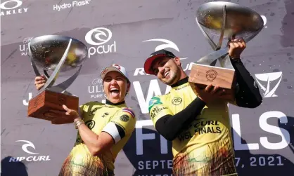  ?? Photograph: Sean M Haffey/Getty Images ?? Carissa Moore of the US and Gabriel Medina of Brazil celebrate after winning the the WSL Finals at Lower Trestles.