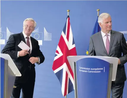  ??  ?? > European Union chief Brexit negotiator Michel Barnier, right, and British Secretary of State David Davis were discussing Britain’s exit from the EU this week