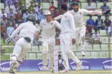  ?? — AFP ?? Zimbabwe cricketers celebrate after winning the match on the fourth day of the first Test cricket match between Bangladesh and Zimbabwe in Sylhet on Tuesday.