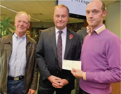  ?? Vincent Cole ?? Vernon Building Society chief executive Mike Hanson with James Harper, right, and Bruce Bissell from Beacon Counsellin­g at last year’s Jubilee cash shareout