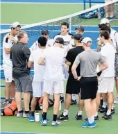  ?? COURTESY OF UCF ATHLETICS ?? UCF tennis players gather around coach John Roddick.