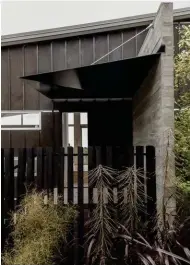  ??  ?? Top A delicately folded steel canopy, which is recessed into the concrete wall, provides shelter at the front door.