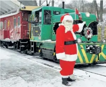  ?? SPECIAL TO POSTMEDIA NEWS ?? All aboard the Port Stanley Santa treats train.