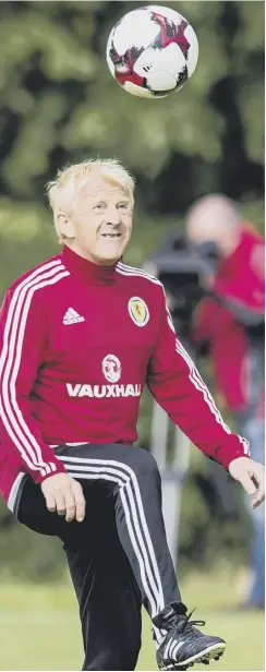  ??  ?? Gordon Strachan shows his footballin­g skills at Mar Hall.