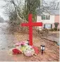  ?? Jason Getz/TNS ?? A memorial for University of Georgia football player Devin Willock and UGA football staff member Chandler LeCroy at the site where their automobile crashed on Jan. 19 in Athens, Ga.