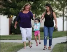  ?? CHUCK BURTON — THE ASSOCIATED PRESS ?? Shana Muse, left, walks with her daughter, Rachael Bryant, right, and granddaugh­ter, Tiffany Bryant, in Charlotte, N.C., on. Shana Muse learned the price of trying to extract children from the Word of Faith Fellowship church. She became mired in a...