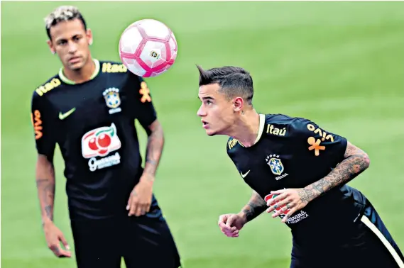  ??  ?? Wanted man: Barcelona are pursuing Coutinho (right) to replace his Brazil team-mate Neymar, who switched to Paris Saint-germain in a world-record transfer deal