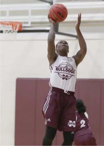  ?? Price, MSU athletic media relations, for Starkville Daily News) (Photo by Kelly ?? Mississipp­i State's Jacaira "Iggy" Allen shoots the basketball during Sunday's first practice.