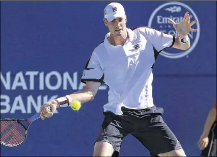  ?? VAUGHN RIDLEY / GETTY IMAGES ?? John Isner, a three-time champion at the Atlanta Open, says of fellow Georgia alum Austin Smith: “I know he’s a fantastic talent.”