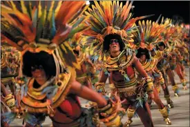  ?? SILVIA IZQUIERDO/ASSOCIATED PRESS ?? Performers from the Salgueiro samba school parade during Carnival celebratio­ns at the Sambadrome in Rio de Janeiro, Brazil, Monday, Feb. 12, 2024.
