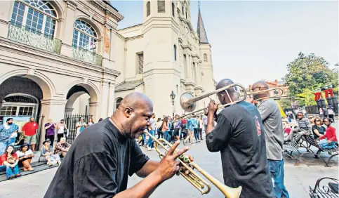  ?? ?? i Get into the spirit of New Orleans: jazz musicians perform in the French Quarter – just one of the stops on Insight Vacations’ 12-day tour of America’s Deep South